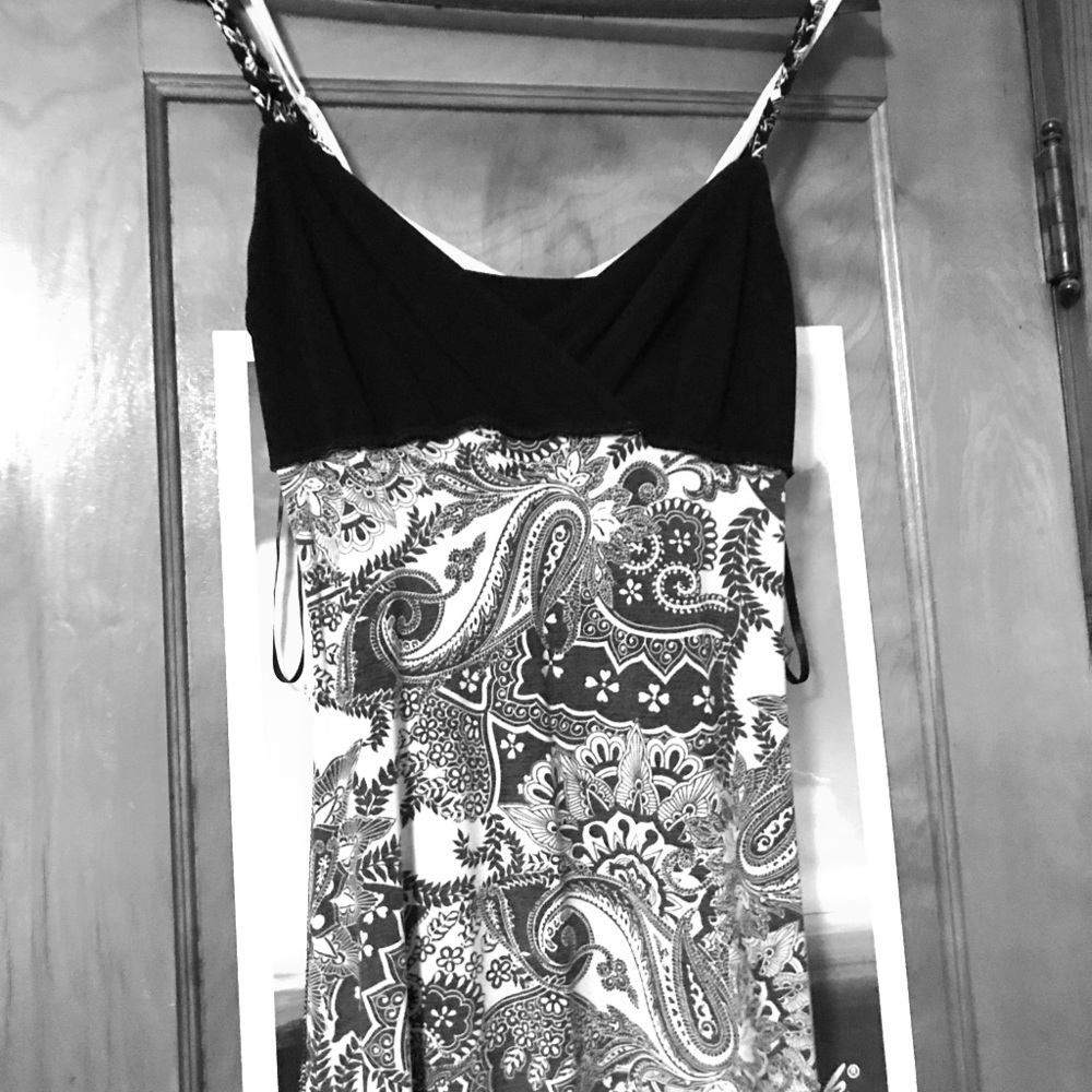 Fitted flattering top, flowy bottom sundress.